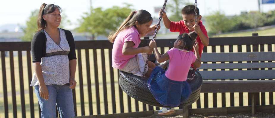 Children on a tire swing