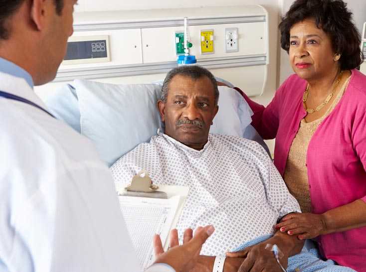 Doctor talking to Man on a stretcher