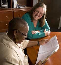 two women reviewing a document