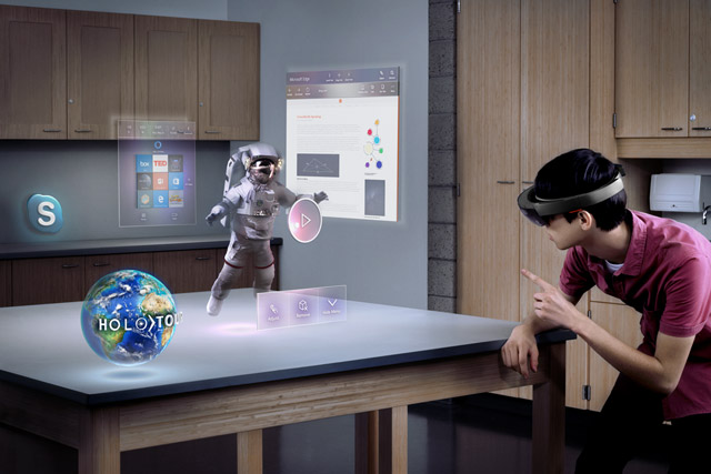 A man uses a Hololens device at home.